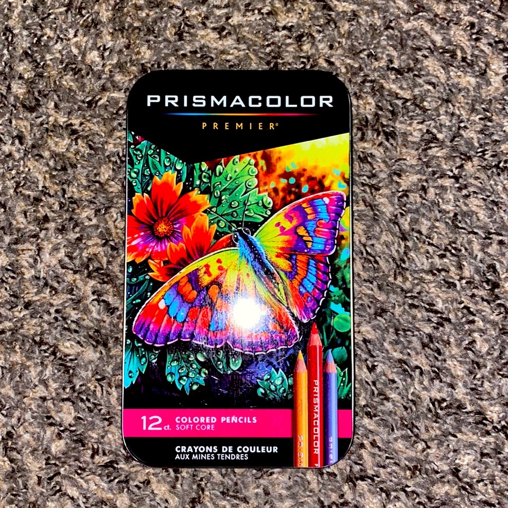 Prismacolor pencils. Used one time since bought